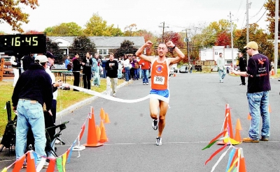 joe-kennedy-breaking-the-tape-at-norwood-5k